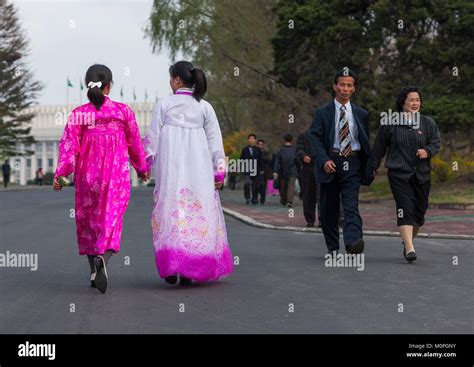 North Korean people with traditional and modern clothes in the street, Pyongan Province ...