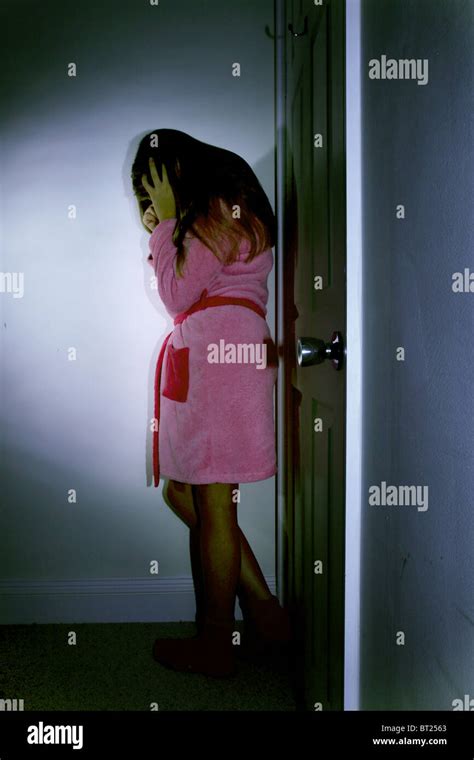 Scared Woman Alone Dark Room Stock Photos & Scared Woman Alone Dark Room Stock Images - Alamy