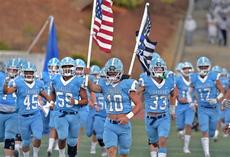 California school system halts football team carrying police flag, dividing community ...