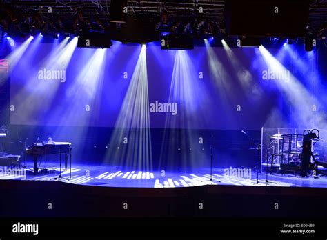 Stage with light beams and piano Stock Photo - Alamy