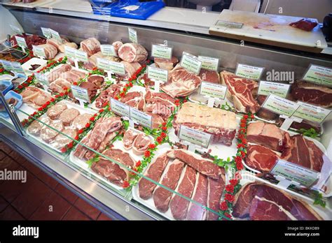 meat display at a butchers shop Stock Photo - Alamy