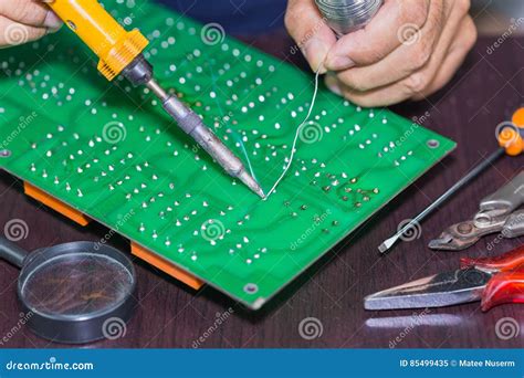 Soldering on circuit board stock image. Image of manual - 85499435