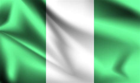 Bandera de nigeria ondeando al viento. | Vector Premium