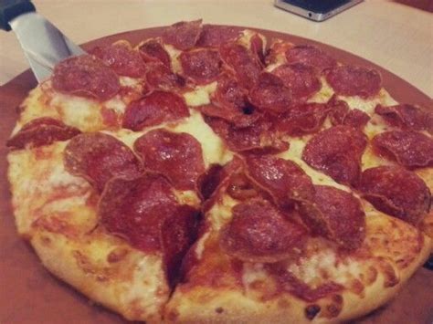 Pizza Hut's classic thin crust pepperoni pizza | Pepperoni pizza, Thin crust, Work lunch