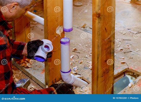 Plumbing Building Contractor Installing Plastic Drain Pipe In Th Royalty-Free Stock Photo ...