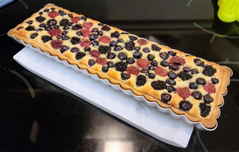 A mixed berry and frangipane tart to test out my new rectangular tart pan. : r/Baking