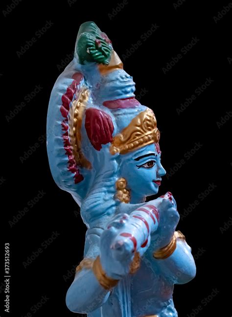 Beautiful statue of Lord Krishna on black background Stock Photo ...