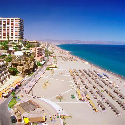 an aerial view of the beach and hotels