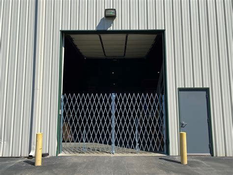 Double Folding Scissor Gates for Warehouse Roll Up Doors - Warehouse ...