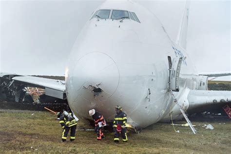 Boeing 747 plane skids off runway in Canada and crashes during landing, leaving four injured