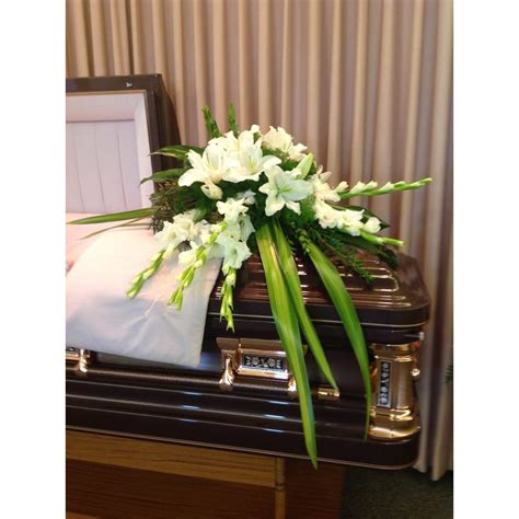 Unique White Casket Spray Missouri Valley IA Florist | M.J.'.S Flowers