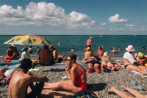 Crowd of People on Seashore Under Blue Sky · Free Stock Photo