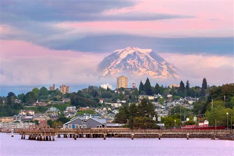 Mount Rainier over Tacoma WA waterfront during alpenglow sunset evening ...