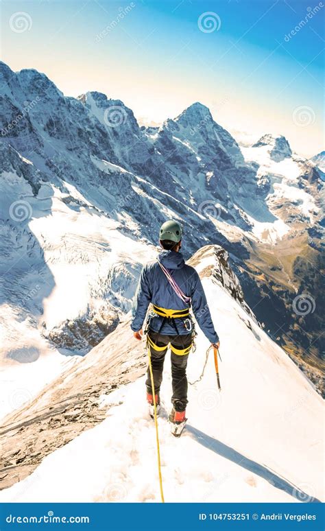 Climber Reaches the Summit of Mountain Peak. Climbing and Mountaineering Sport Concept Stock ...