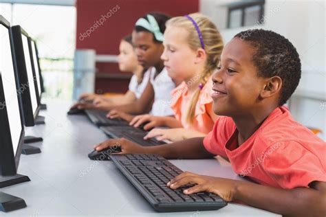 School kids using computer in classroom Stock Photo by ©Wavebreakmedia ...