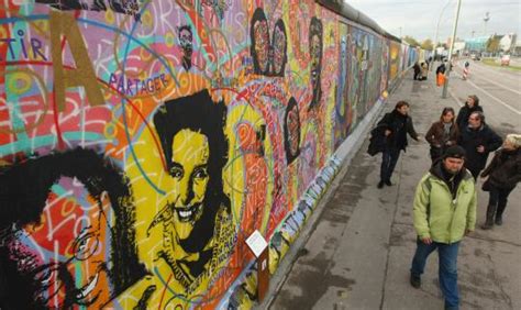 Two decades later, repainted murals on Berlin Wall celebrate freedom - The Boston Globe