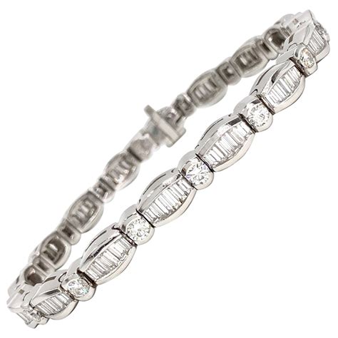 Estate 18 Karat White Gold Emerald Cut, Baguette, and Round Diamond Bracelet For Sale at 1stDibs