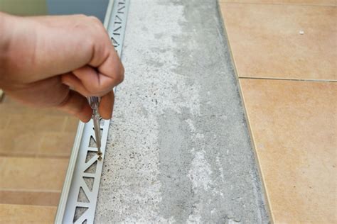 Securing metal tile edging with screws | HowToSpecialist - How to Build ...