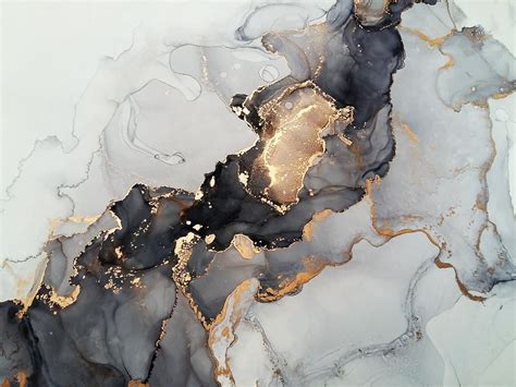 an abstract marble background with gold and black