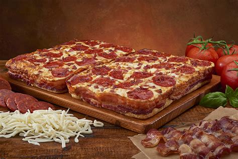 Little Caesars unveils pizza with 3.5 feet of bacon crust | Crain's Detroit Business