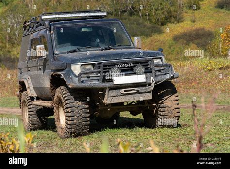 Toyota Land Cruiser Prado - Japanese extreme off-road expedition truck on autumn forest ...