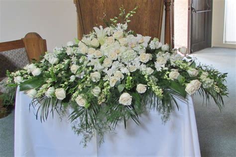 All White Full Casket Spray by Crown Valley Florist