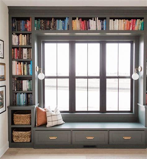 Built in bookshelf frames double hung windows in reading nook – Artofit