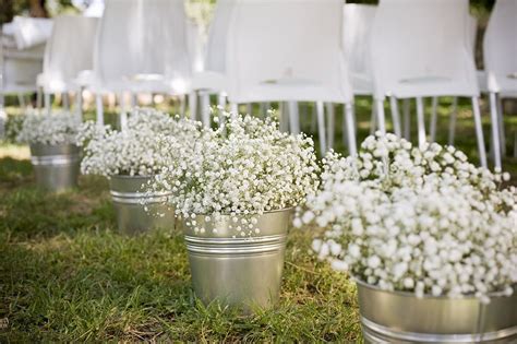 Wedding aisle - tin buckets with lots of Gypsophila flowers. Wedding ...