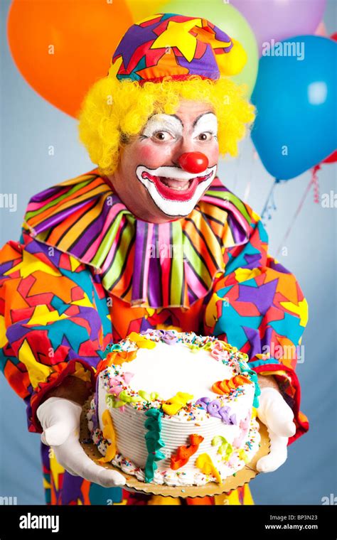 Happy birthday clown holding a birthday cake. Cake is ready for your ...