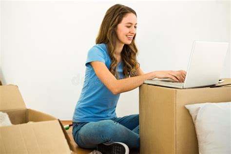 Girl typing on her laptop stock photo. Image of dark - 65387524