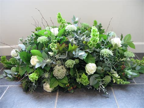 A casket with a natural feel, including thistles, cow parsley and ...