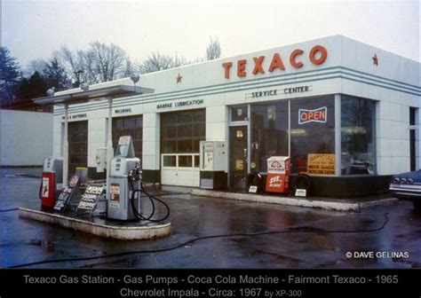 an old texaco gas station in the rain