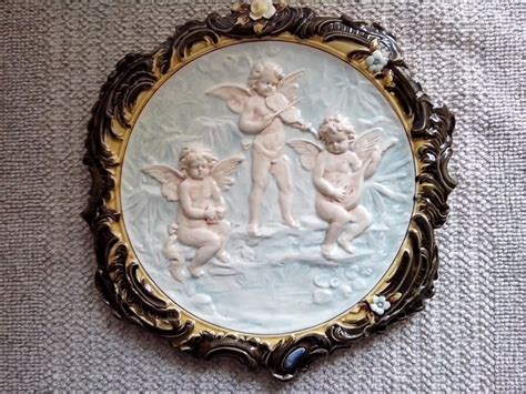 Vintage cherub embossed glazed wall plaque - Catawiki