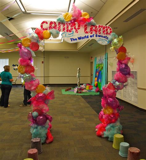 Candyland arch...We made candy from paper plates, balloons, and cotton candy from Poly fill spay ...