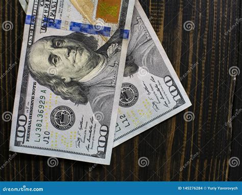 Two Hundred Dollars Bills on a Wooden Background. New Hundred Dollar Bill Stock Photo - Image of ...