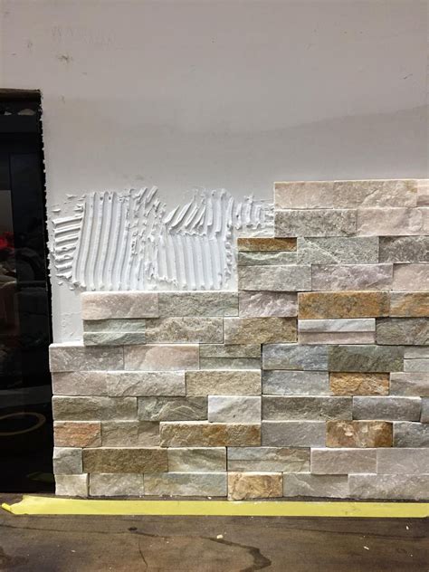 How to install stacked stone tile on a fireplace wall from Thrifty Decor Chick