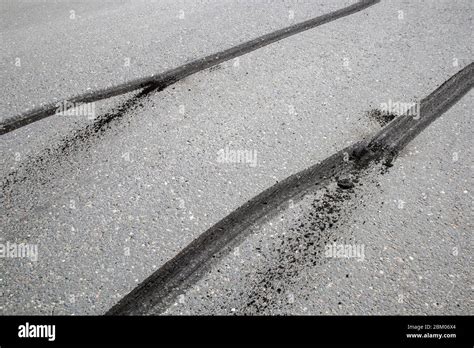 car tyre skid marks on road Stock Photo - Alamy