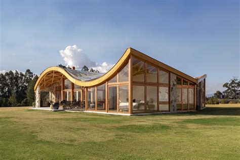 The Wavy Roof On This House Also Has An Exposed Wood Structure On The Interior - Design Skill ...