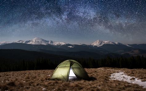 Premium Photo | Night camping. illuminated tourist tent under beautiful ...