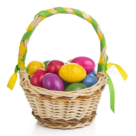 Colorful easter eggs in basket isolated | Stock image | Colourbox