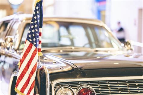 Premium Photo | Us flag on an old vintage car