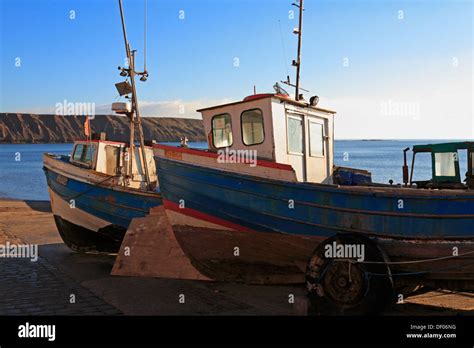 Coble fishing boats on the Coble Landing, Filey, North Yorkshire, England, UK Stock Photo - Alamy