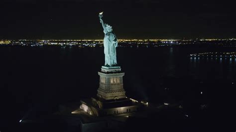 6K stock footage aerial video orbiting the Statue of Liberty at Night ...