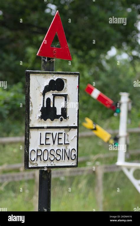 Vintage, Old Level Crossing Sign With A Picture Of A Steam Train And Warning Triangle In Front ...