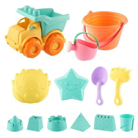 a play set with toys such as sand, shovels and scoopers on white background