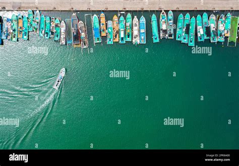 Aerial view of fishing boats at harbor Stock Photo - Alamy