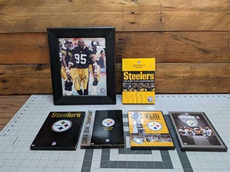 Greg Lloyd Autograph Photograph and Steelers DVDs - Bid On Estates Auction Services