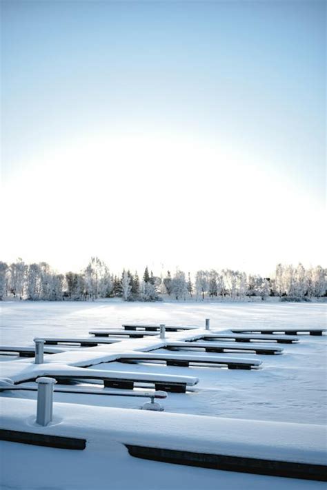 Frozen Lake and a Dock during a Winter's Day · Free Stock Photo