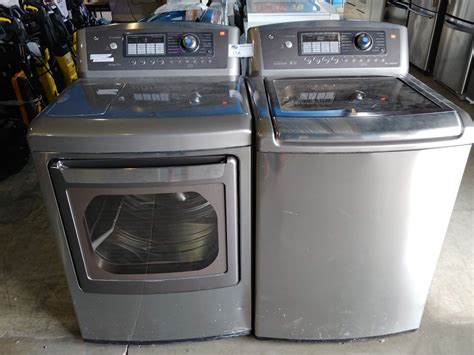 GREY LG WAVEFORCE WASHER AND TRUE STEAM DRYER SET - Able Auctions