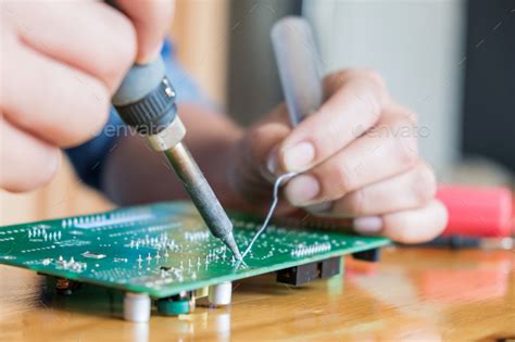 Technician repair circuit board,Use soldering equipment on circuit boards. Stock Photo by ...